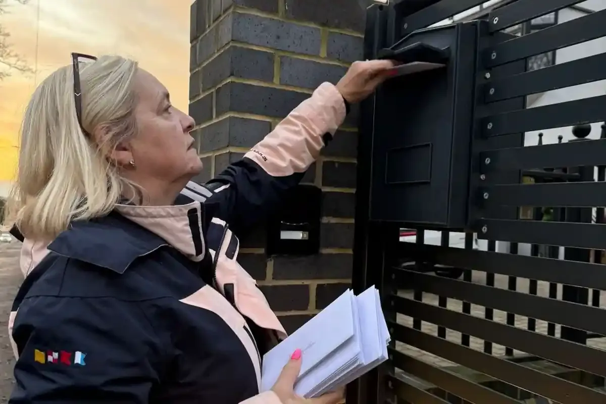 Cllr Lisa Morgan delivering cards